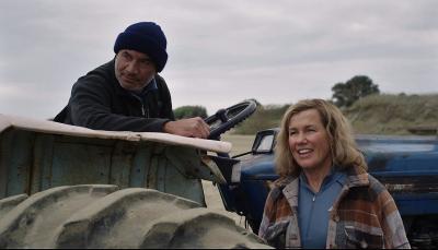 Temuera Morrison as Ed and Robyn Malcolm as Heather on their tractor in Far North