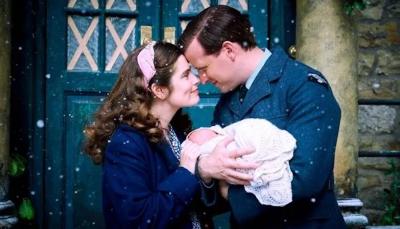 Rachel Shenton as Helen Herriot and Nicholas Ralph as James Herriot hold their newborn in 'All Creatures Great and Small' Season 4