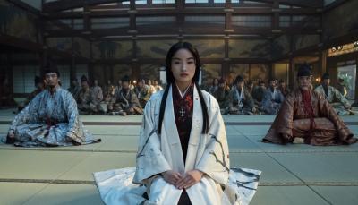 Eita Okuno as Saeki Nobutatsu, Anna Sawai as Toda Mariko, Hiromoto Ida as Kiyama Ukon Sadanaga sit at the feet of their leader in 'Shogun'