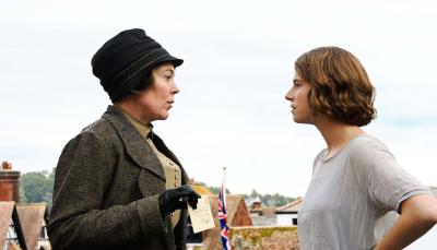 Olivia Colman as Edith Swan waves a poison pen letter at Jessie Buckley as Rose Gooding, its suspected author in 'Wicked Little Letters'