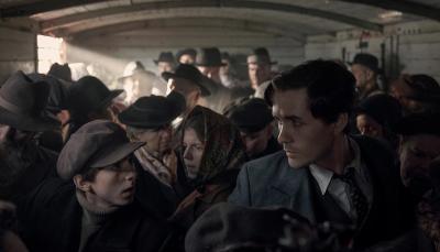 Jonah Hauer King as Lali Sokolov on the train in 'The Tattooist Of Auschwitz' 