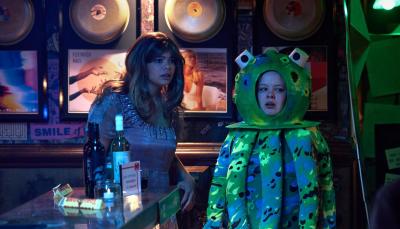 Lydia West as Eddie, dressed as a character from Love Actually, and Nicola Coughlan as Maggie, dressed as an octopus, in a darkened bar