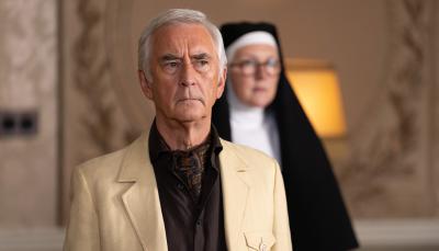 Denis Lawson as Lincoln Leigh Varsey doesn't know Lorna Watson as Sister Boniface lurks behind him in the Sister Boniface Mysteries Season 3