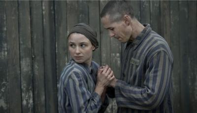 Picture shows: Jonah Hauer-King (Lali), Anna Próchniak (Gita Furman) in Auschwitz