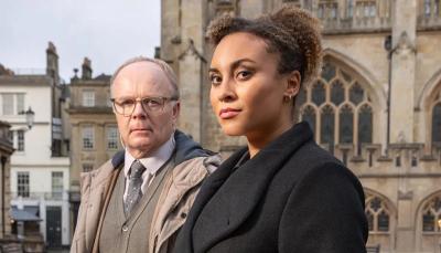Picture shows: Police officers DS Dodds (Jason Watkins), and DCI Lauren McDonald (Tala Gouveia) pose in front of Bath Abbey.