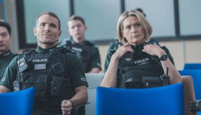 Picture shows: Grace (Siân Brooke) and Stevie (Martin McCann) seated at a briefing.