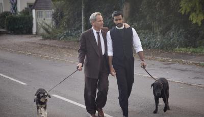 Robson Green as Geordie Keating, Rishi Nair as Alphy Kotteram walking their puppers in 'Grantchester' Season 9
