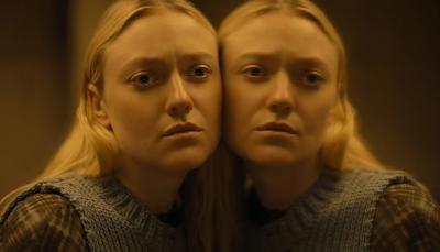 Dakota Fanning as Mina pressed against her reflection in The Watchers