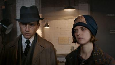Volker Bruch as Inspector Gereon Rath and Liv Lisa Fries as Charlotte Ritter question a suspect in 'Babylon Berlin' Season 3