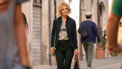 Emilia Fox as Sylvia Fox walking down the streets of Italy in 'Signora Volpe' Season 2