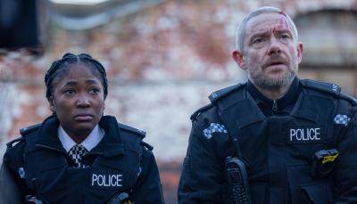 Adelayo Adedayo as Rachel Hargreaves and Martin Freeman as Chris Carson sit together onthe wall in 'The Responder' Season 2