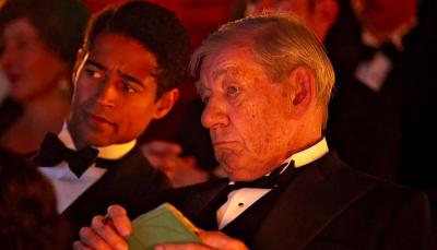  Alfred Enoch as Tom Turner and Ian McKellen as Jimmy Erskine critically watching a play in 'The Critic'