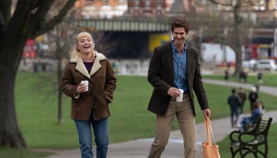 Florence Pugh as Almut and Andrew Garfield as Tobias walk down the sidewalk in 'We Live In Time'