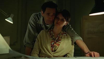 Adrien Brody as László Tóth and Felicity Jones as Erzsébet Tóth in 'The Brutalist'