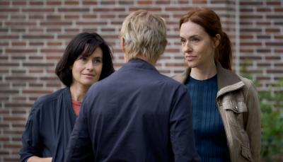 Maimie McCoy and Kim Reidle as Lucienne and Kalie, ganging up on March Warren as Van der Valk in 'Van der Valk' Season 4