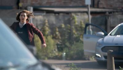 Picture shows: DS Sarah Collins (Gemma Whelan) runs to save a woman from a burning car.