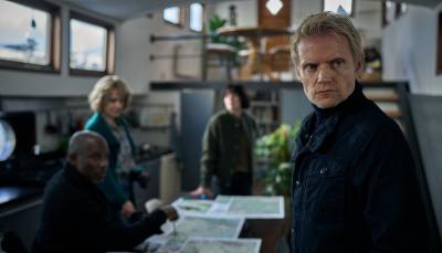 Dennis Rudge as Marcus, Raquel Cassidy as Anki, Maimie McCoy as Lucienne, and Marc Warren as Piet Van der Valk in 'Van der Valk' Season 4