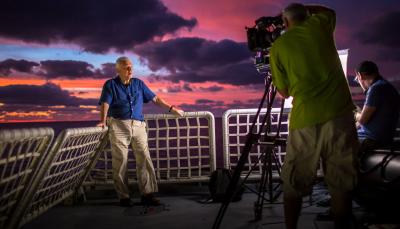 Sir David Attenborough filming aboard the research vessel Alucia in 2015 for 'David Attenborough’s Great Barrier Reef'