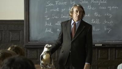Steve Coogan as Tom Mitchell with his penguin bestie in 'The Penguin Lessons'