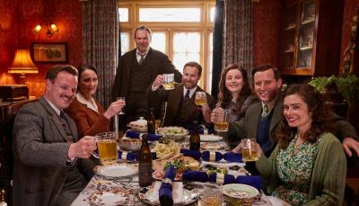 Picture shows: Christmas dinner, L to R, Tristan Farnon (Callum Woodhouse), Audrey Hall (Anna Madeley), Richard Alderson (Tony Pitts), Siegfried Farnon (Samuel West), Jenny Alderson (Imogene Clawson), James Herriot (Nicholas Ralph), and Helen Herriot (Rachel Shenton) raise their glasses in a toast at Christmas dinner