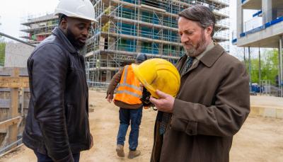 Dipo Ola and David Mitchell in 'Ludwig' Season 1