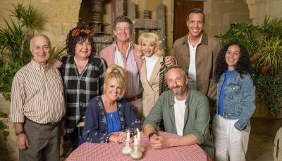 Tony Robinson as Uncle Patrick, Sue Vincent as Gloria Beauchamp, Sally Lindsay as Jean White, Robin Askwith and Sue Holderness as Jeremy and Judith Lloyd James, Steve Edge as Dom Hayes, Alex Gaumond as Caron, and Jacqueline Berces as Gendarme Richard in 'The Madame Blanc Mysteries' Season 4
