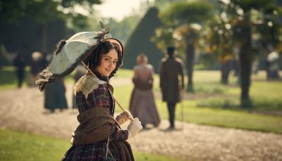 Ella Purnell as Lady Maria Grey walks in the park in 'Belgravia' Season 1