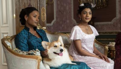 Simone Ashley and Charithra Chandran as Kate and Edwina with Newton
