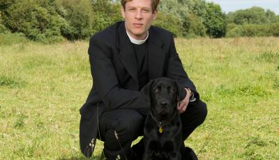 James Norton in "Grantchester", with a much younger Dickens! Photo:  Courtesy of (C) Des Willie/Lovely Day Productions & ITV for MASTERPIECE