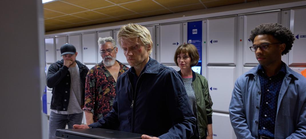 Picture shows: Luke Allen-Gale as Brad de Vries, Darrel D'Silva as Hendrik Davie, Marc Warren as Piet Van der Valk, Maimie McCoy as Lucienne Hassel, and Elliot Barnes-Worrell as Job Cloovers In Valk der Valk Season 2