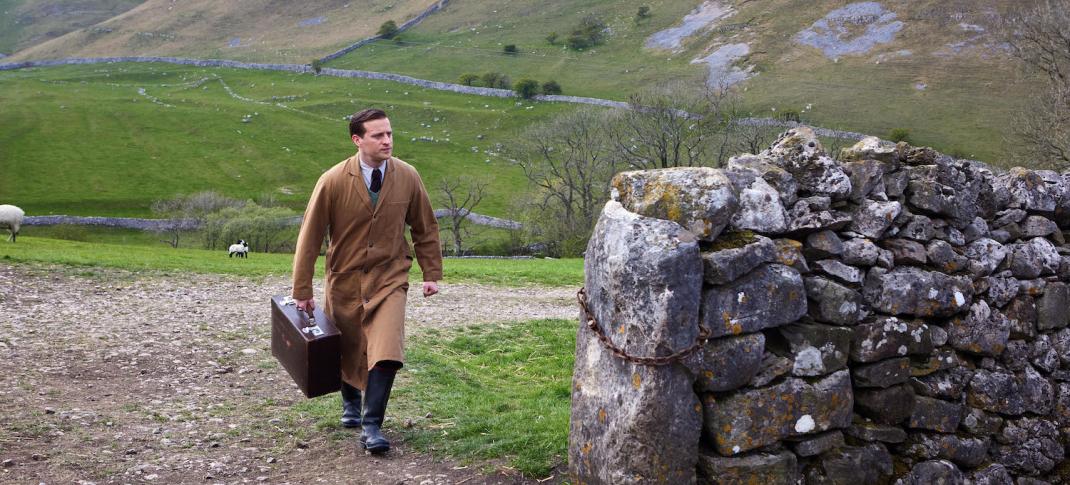 Picture shows: James Herriot (Nicholas Ralph) shown against the vast backdrop of the Yorkshire fells, on his way to visit a patient