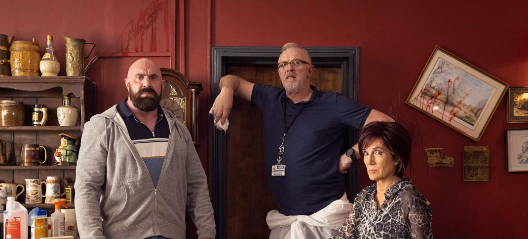 Charlie Rawes as Cuddle, Greg Davies as Paul 'Wicky' Wickstead, and Harriet Walter as Lisa in 'The Cleaner' Season 2.