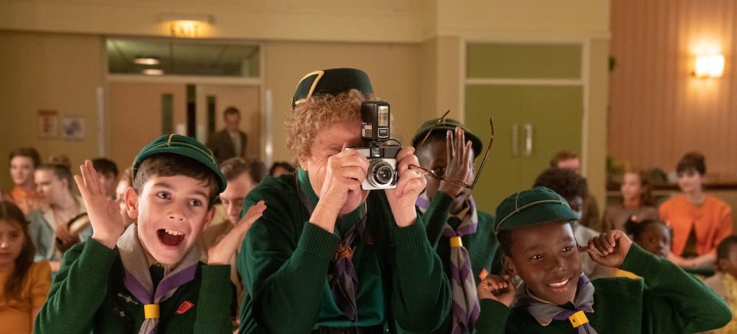 Picture shows: Nurse Phyllis Crane (Linda Bassett) takes a photograph surrounded by enthusiastic Cub Scouts