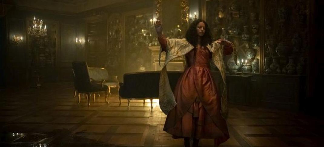 Shalom Brune-Franklin as Estella dancing alone in a gritty, dark parlor in 'Great Expectations' Episode 4