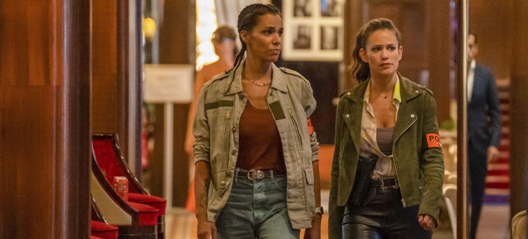 Tamara Marthe as Léa Robert and Lucie Lucas as Det Camille Delmasse walk through a fancy hotel in 'Cannes Confidential' Season 1