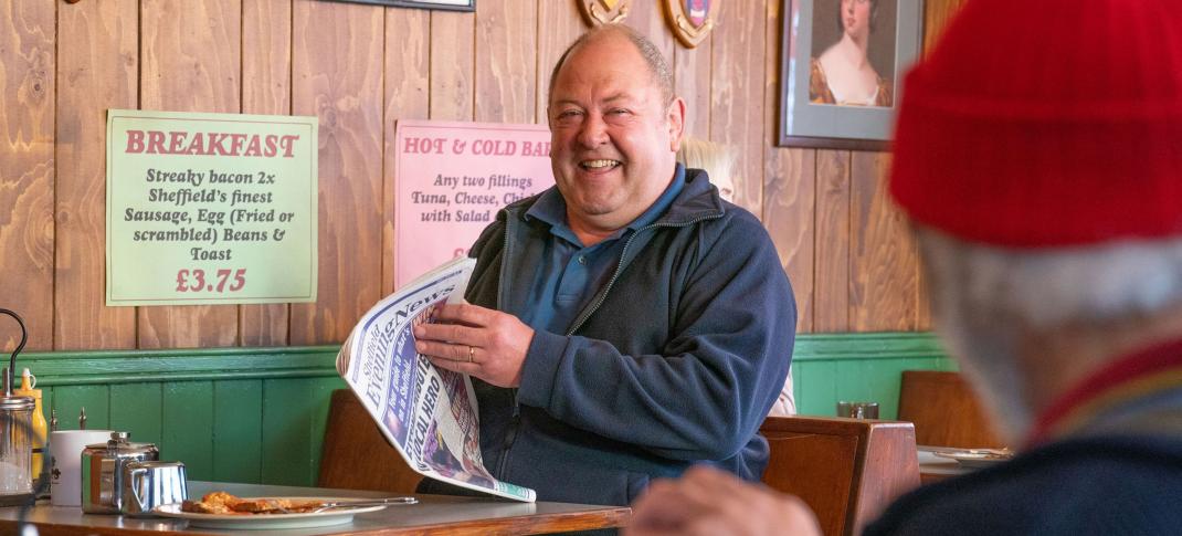 Mark Addy as Dave having breakfast at the diner in The Full Monty