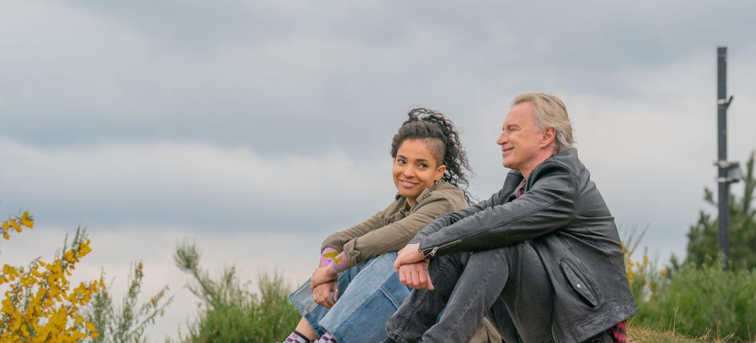 Talitha Wing as Destiny hangs out on the side of a hill with Robert Carlyle as her father Gaz in 'The Full Monty'