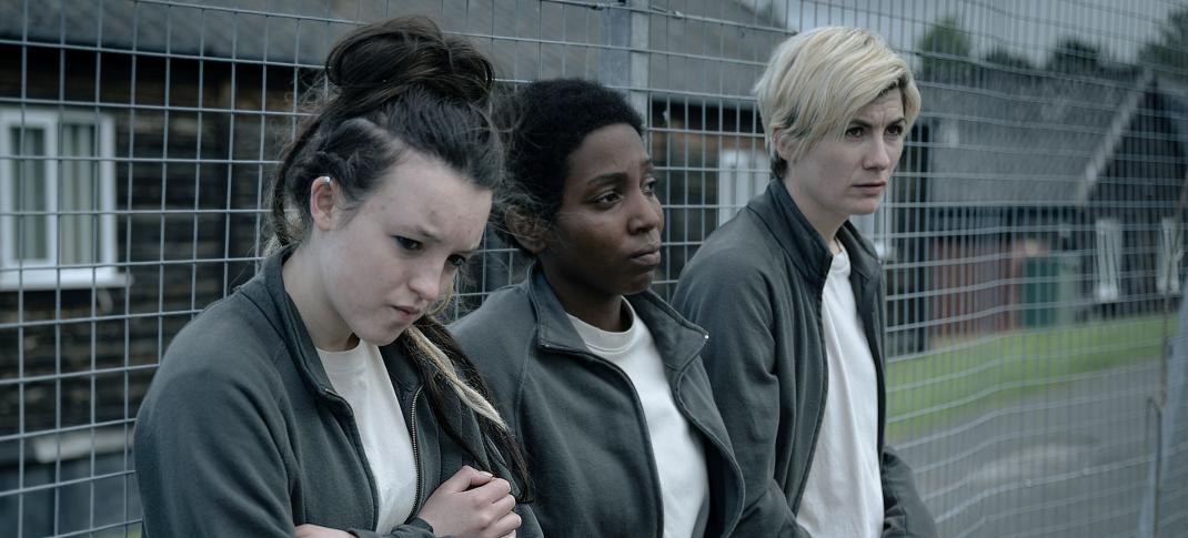 Bella Ramsey as Kelsey, Tamara Lawrance as Abi, and Jodie Whittaker as Orla in the prison yard 'Time' Season 2