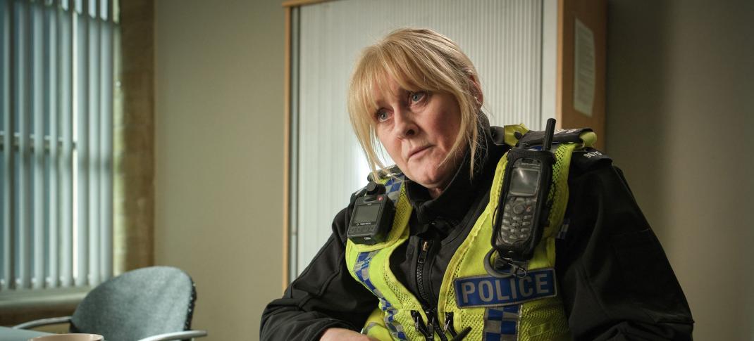 Sarah Lancashire as Catherine Cawood looks up from her note taking in Happy Valley Season 3