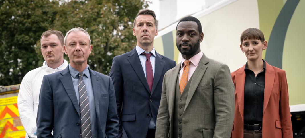 Brad Morrison as DC Nick Nicholls, John Simm as DS Roy Grace, Craig Parkinson as DS Norman Potting, Richie Campbell as DS Branson, and Laura Elphinstone as DS Bella Moy pose at the crime scene in Grace Season 3