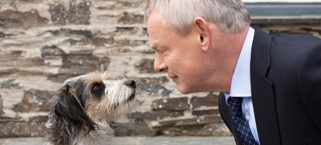 Picture Shows: Doc Martin (Martin Clunes) nose to nose with a small cute dog.