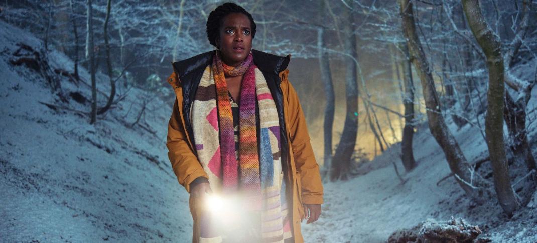 Wunmi Mosaku as Former Met Police Detective Riya Ajunwa searches through the snowy woods in 'Passenger'