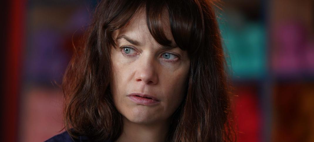 Ruth Wilson as Lorna Brady looks afraid in 'The Woman In The Wall'