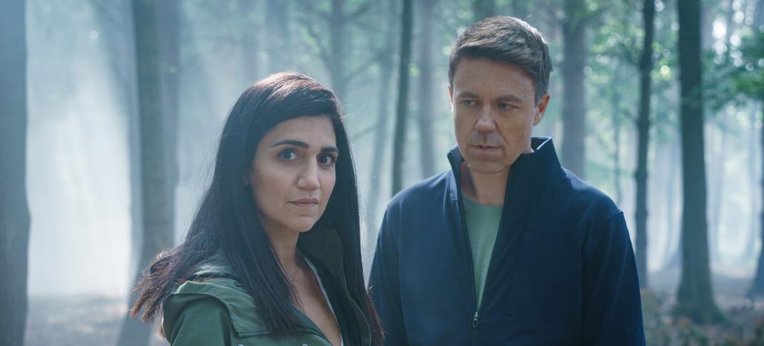 Leila Farzad as DCI Lou Slack and Andrew Buchan as Col McHugh in a forest in 'Better'