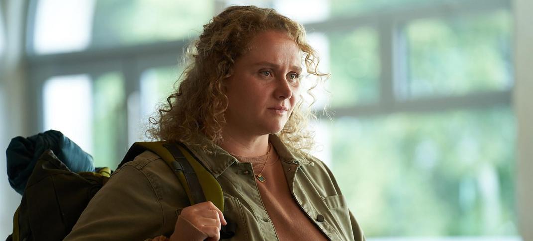 Danielle Macdonald as PC Helen Chambers has her backpack and is ready to travel in The Tourist Season 2
