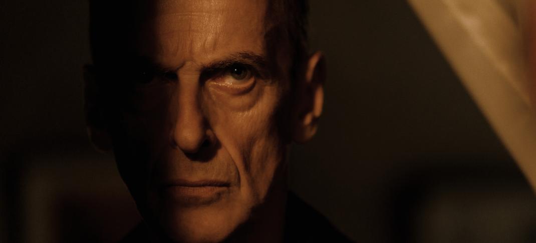 PPeter Capaldi as Detective Chief Inspector Daniel Hegarty half in. the shadows like a good evil person in 'Criminal Record' Season 1