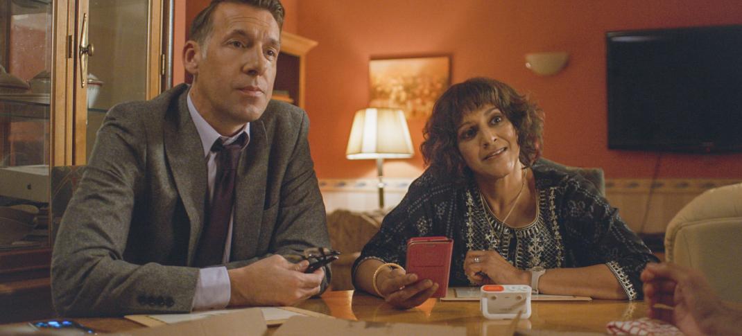 Craig Parkinson as DCI Burton and Meera Syal as Mrs. Sidhu question suspects over food in 'Mrs. Sidhu Investigates' Season 1