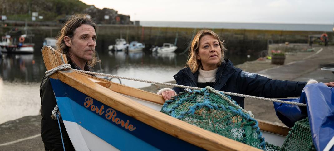 Jamie Sives as Michael McAndrews and Nicola Walker as Annika Strandhed prep a rowboat in 'Annika' Season 2