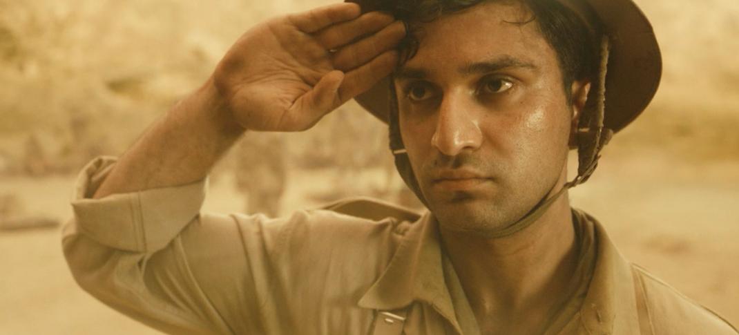 Ahad Raza Mir as Rajib saluting in World on Fire Season 2