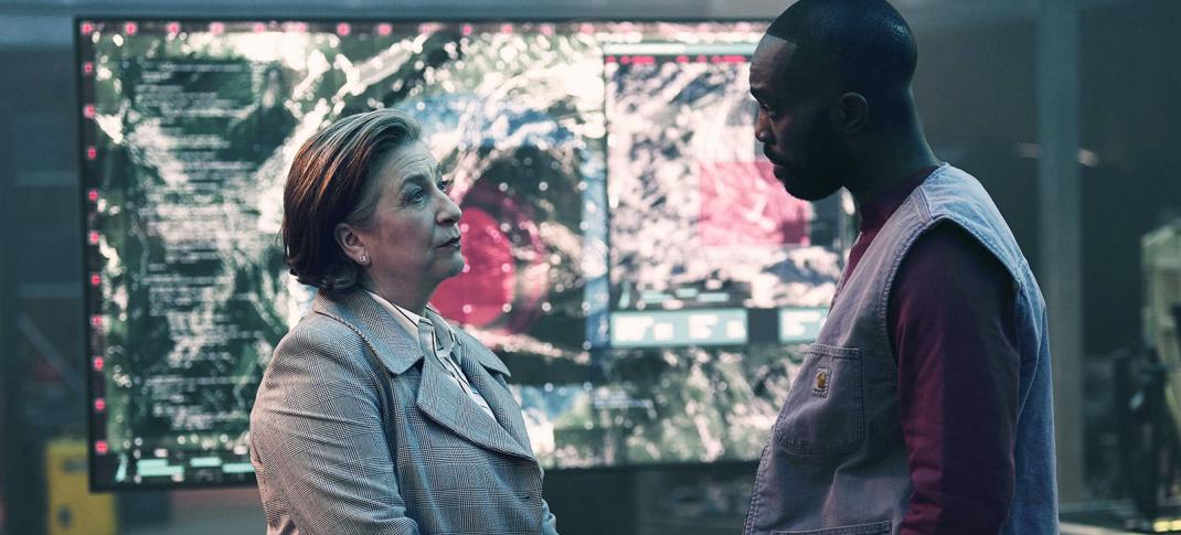 Caroline Quentin as Wes and Paapa Essiedu as George stand in the secret base in 'The Lazarus Project' Season 2